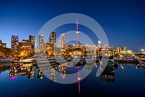 Toronto city skyline at Night fromÂ Marina Quay West, Ontario, Canada